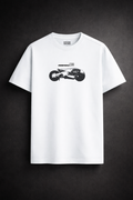 White t-shirt with a black graphic on a dark background